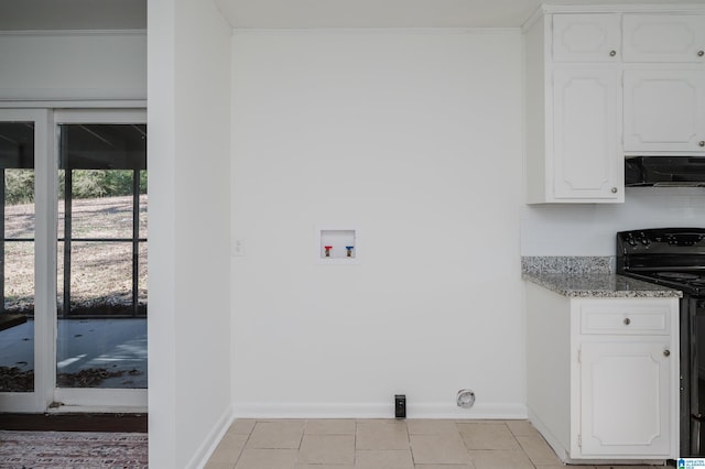 laundry room featuring light tile patterned floors and hookup for a washing machine