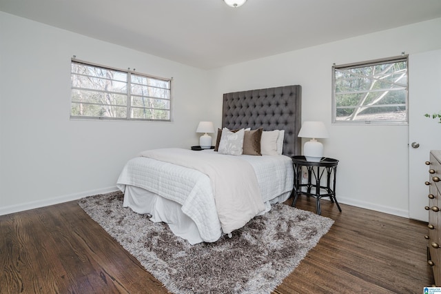 bedroom with dark wood-type flooring