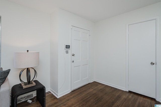 entrance foyer featuring dark hardwood / wood-style flooring