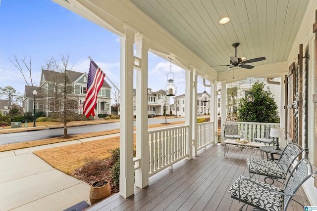 deck featuring ceiling fan and a porch