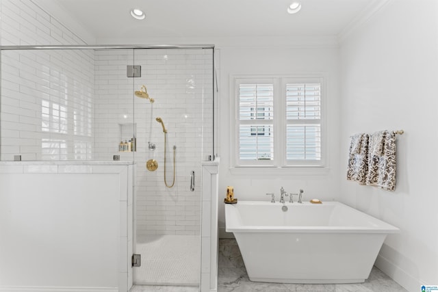 bathroom featuring crown molding and plus walk in shower