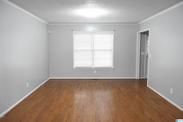 empty room with a textured ceiling, dark hardwood / wood-style flooring, and crown molding