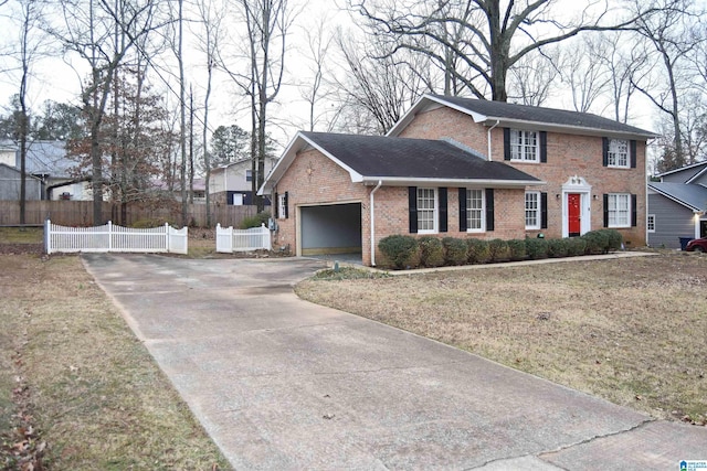 view of front of property with a front lawn and a garage