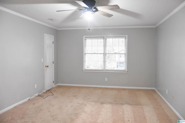 carpeted empty room featuring a textured ceiling, ceiling fan, and ornamental molding