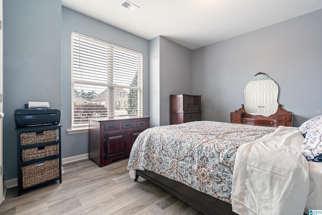 bedroom featuring light wood-type flooring