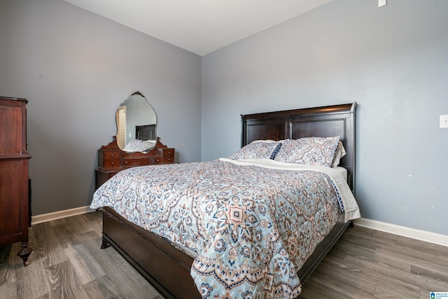 bedroom with hardwood / wood-style floors