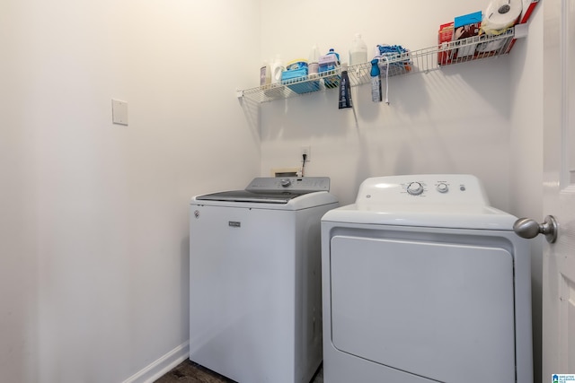 laundry room featuring washer and clothes dryer