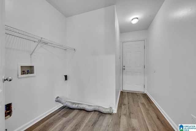 laundry area featuring hookup for a washing machine and light hardwood / wood-style flooring