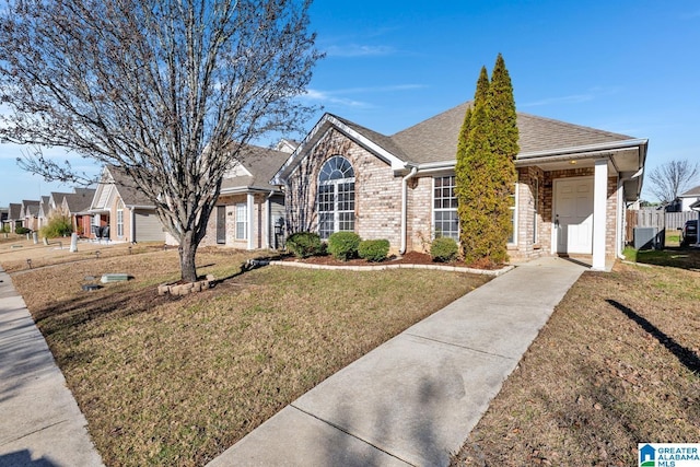 ranch-style home featuring a front yard