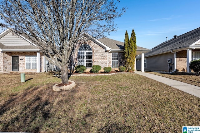 ranch-style home featuring a front yard