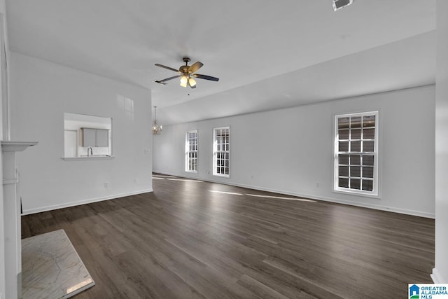 unfurnished living room with lofted ceiling, dark hardwood / wood-style flooring, and ceiling fan with notable chandelier