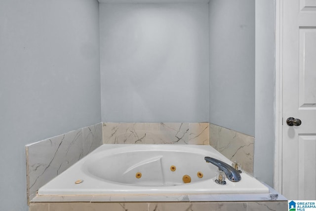 bathroom featuring tiled bath