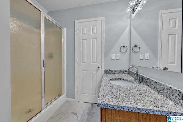 bathroom with an enclosed shower and vanity