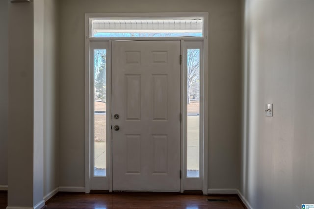 foyer with dark hardwood / wood-style flooring