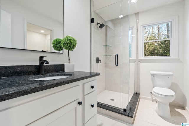 bathroom featuring an enclosed shower, tile patterned floors, vanity, and toilet