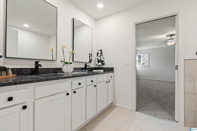 bathroom featuring ceiling fan, vanity, and tile patterned flooring