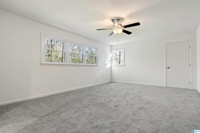 carpeted empty room with ceiling fan