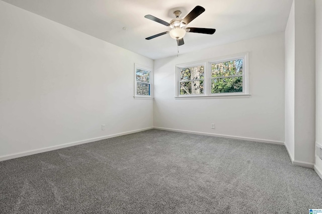 carpeted empty room featuring ceiling fan