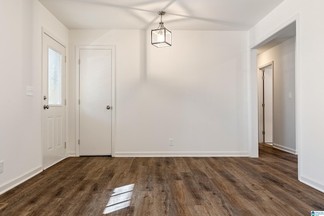 unfurnished dining area with dark hardwood / wood-style floors