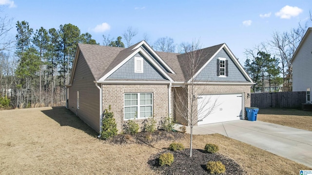 view of front of property featuring a garage and a front yard