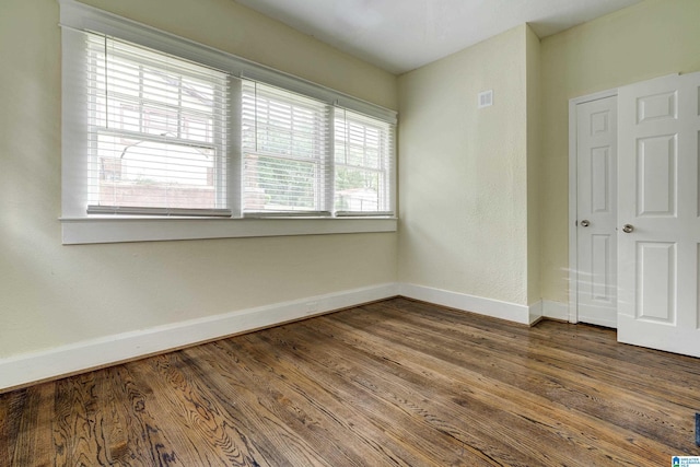 empty room featuring hardwood / wood-style floors