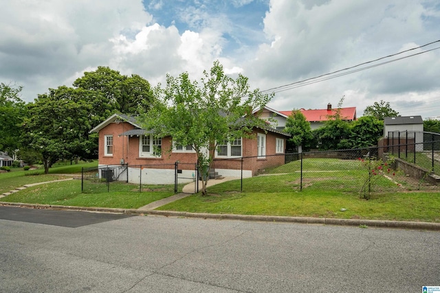 view of front of property featuring a front lawn and cooling unit