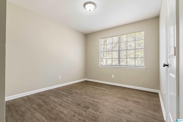 unfurnished room featuring dark hardwood / wood-style flooring