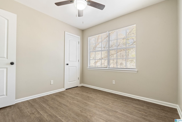 spare room featuring ceiling fan and hardwood / wood-style flooring