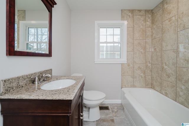 bathroom featuring a bath, toilet, and vanity