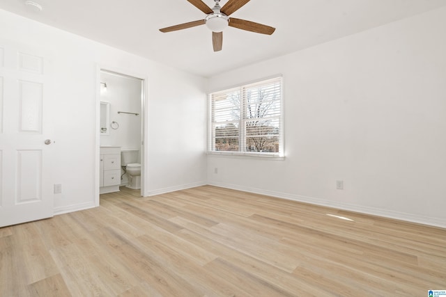 unfurnished bedroom with ceiling fan, ensuite bathroom, and light hardwood / wood-style flooring