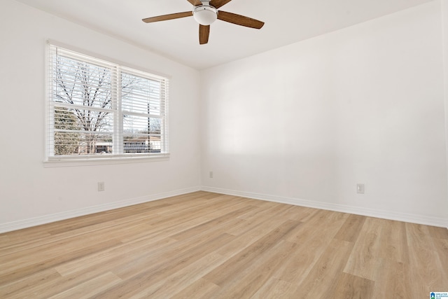 empty room featuring light wood-type flooring and ceiling fan