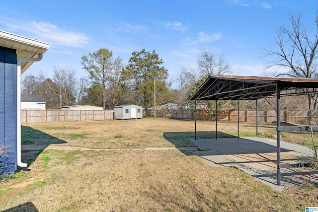 view of yard with a patio area and a shed