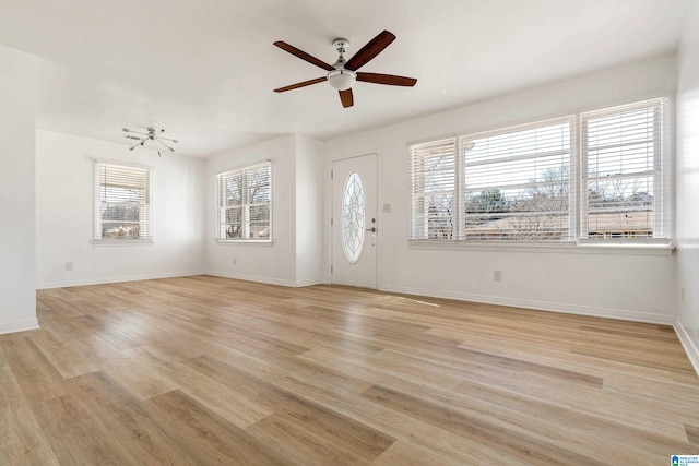 entryway featuring light wood-type flooring and ceiling fan