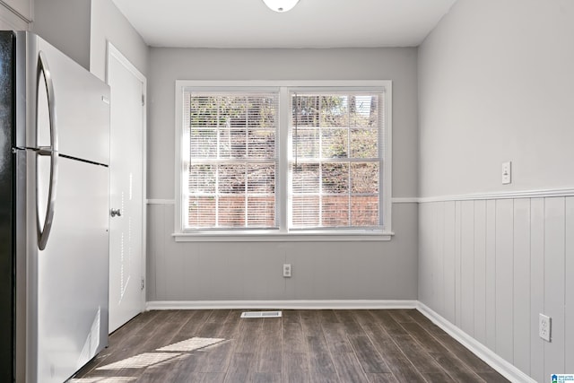 empty room with dark hardwood / wood-style floors