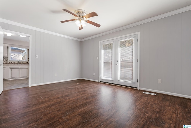 unfurnished room with french doors, sink, dark hardwood / wood-style floors, ornamental molding, and ceiling fan