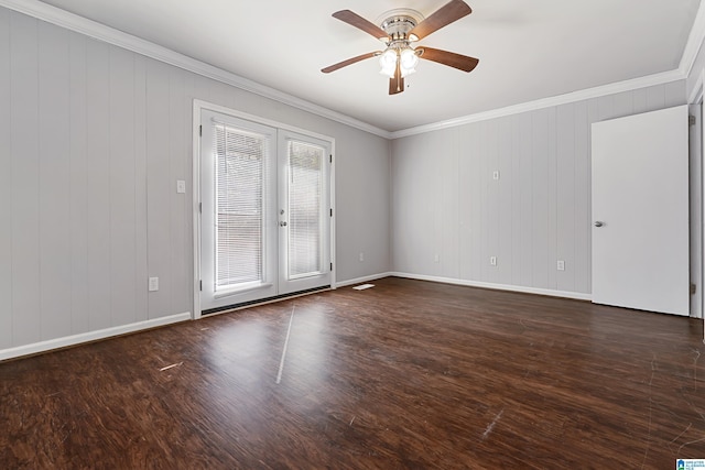 spare room featuring dark wood-type flooring, plenty of natural light, crown molding, and french doors