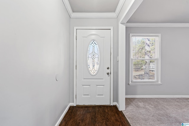 carpeted entrance foyer with crown molding