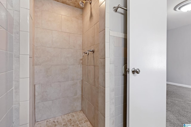 bathroom with a tile shower