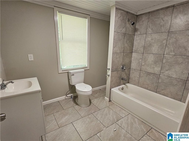 full bathroom featuring toilet, tiled shower / bath, and vanity