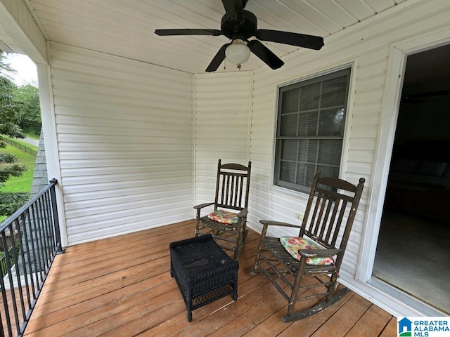 wooden terrace featuring ceiling fan