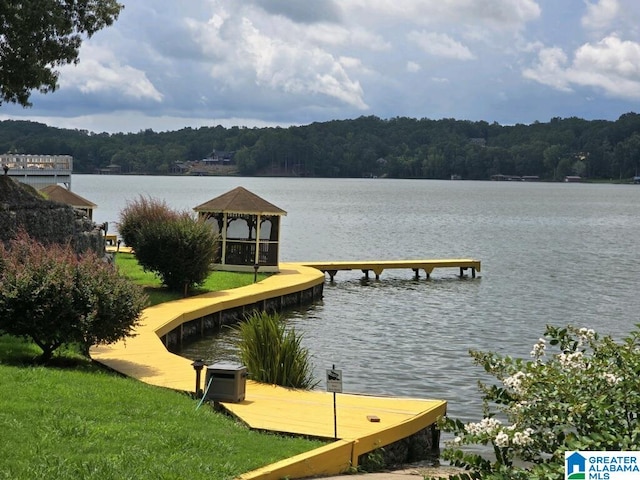 dock area featuring a water view, central AC unit, and a gazebo