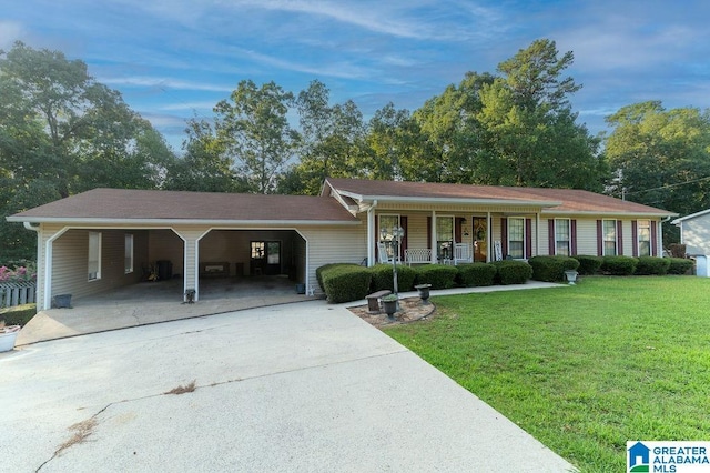 single story home featuring a front lawn, a carport, and a porch