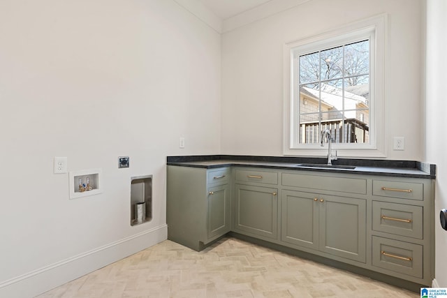 washroom featuring sink, crown molding, light parquet floors, cabinets, and washer hookup