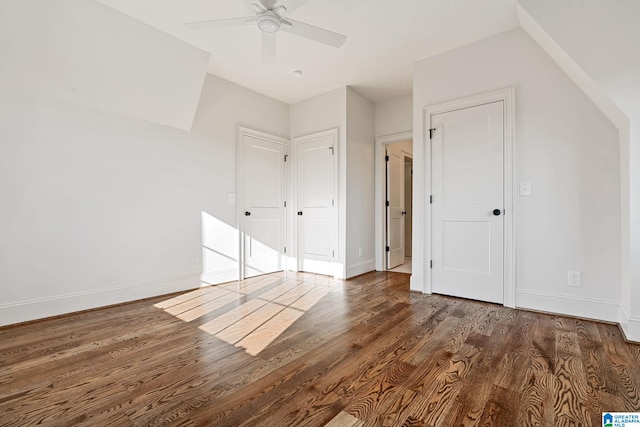 additional living space with ceiling fan and dark hardwood / wood-style flooring