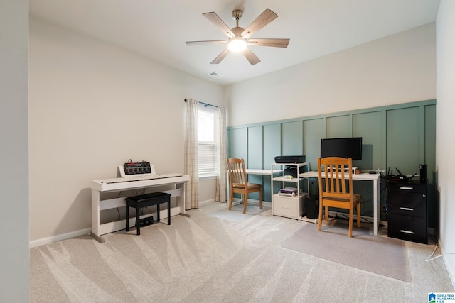 carpeted office featuring ceiling fan