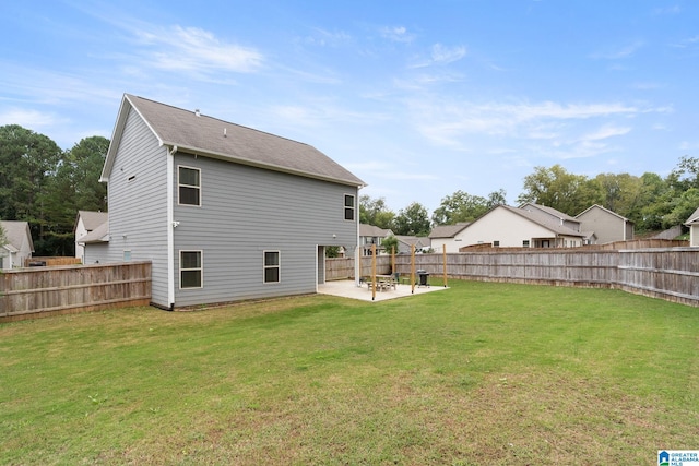 rear view of property with a patio area and a yard