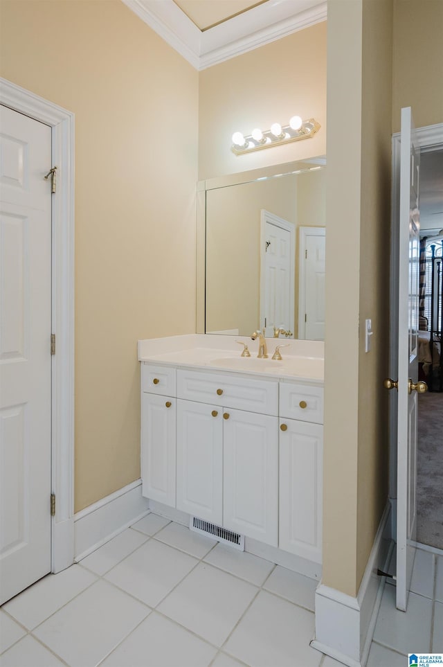 bathroom with tile patterned floors, vanity, and ornamental molding