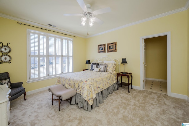 carpeted bedroom with ceiling fan and crown molding