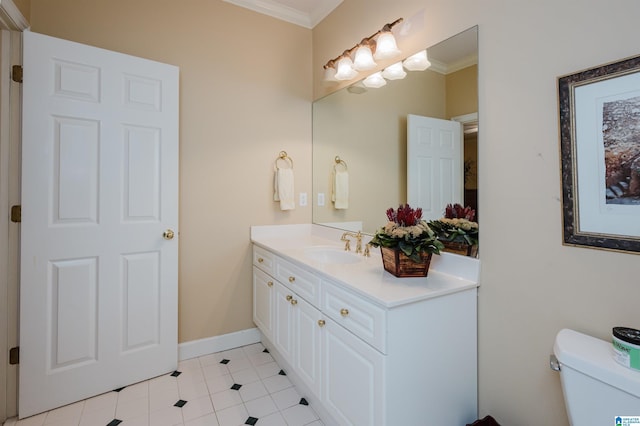 bathroom with crown molding, toilet, tile patterned floors, and vanity