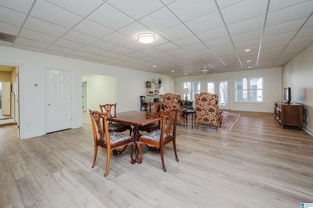 dining space featuring light wood-type flooring